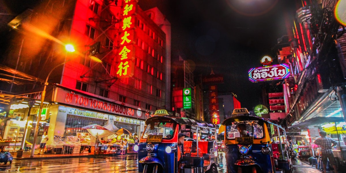 Golden sunset over Bangkok skyline with Wat Arun temple