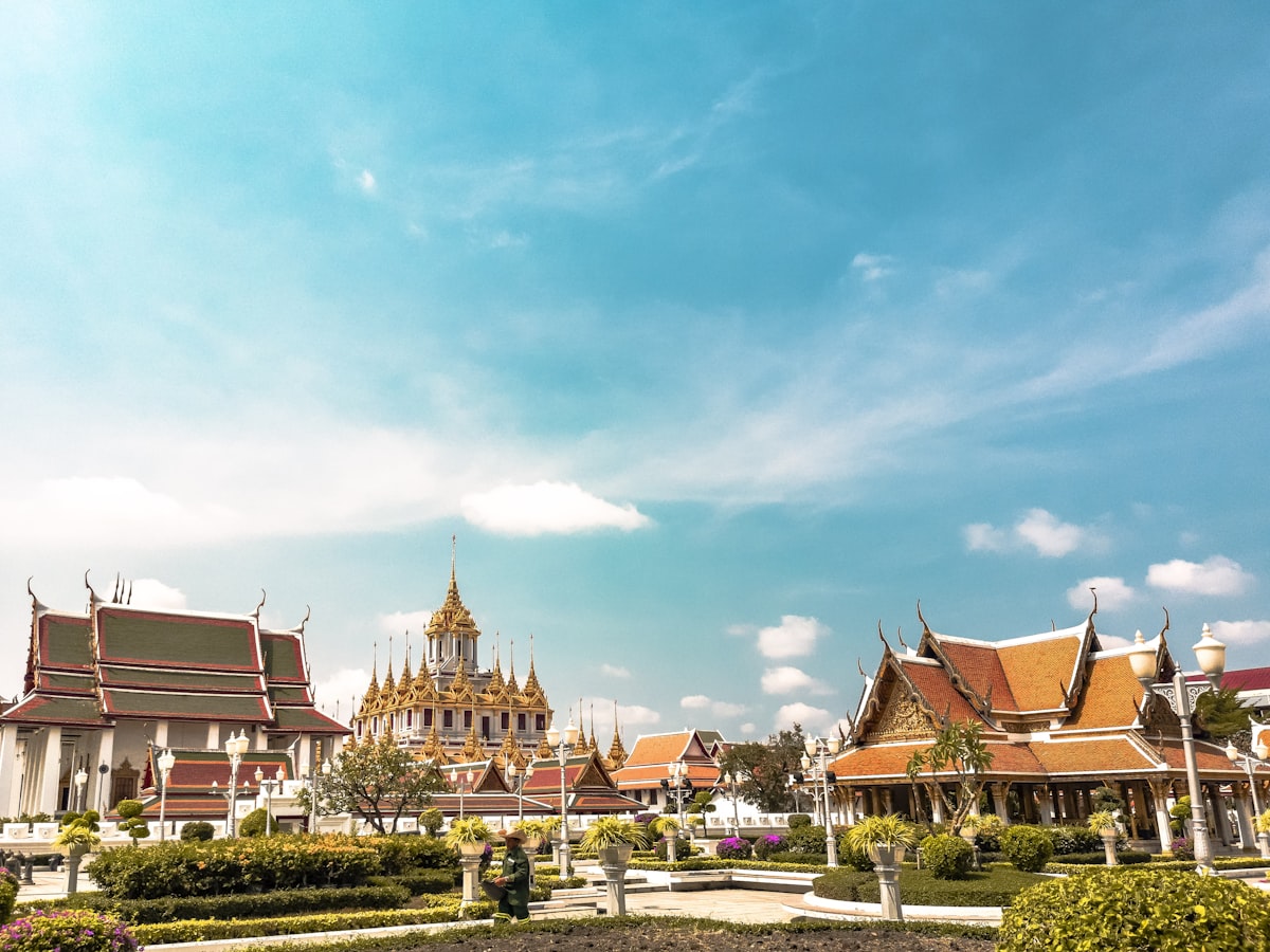 Wat Arun temple at sunset reflecting on the Chao Phraya River